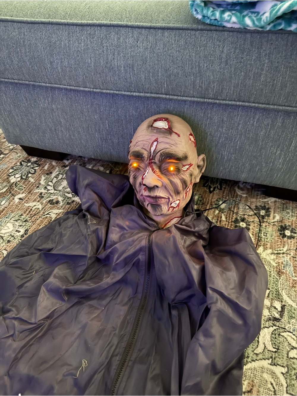 Animated Halloween Zombie Head Prop with Glowing Amber Eyes - Purple